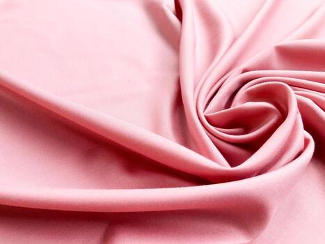 Soft silk textile texture for background. Abstract pink fabric for poster, banner, wallpaper and creative project. photo