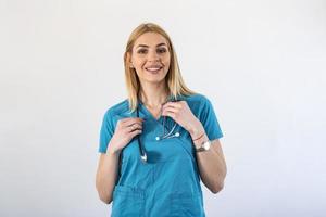Beautiful young female medical doctor is looking at camera and smiling Shot of a female doctor standing confidently with her arms crossed photo