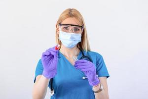 Female caucasian doctor holding a swab collection stick, nasal and oral specimen swabbing , patient PCR testing procedure appointment, Coronavirus COVID-19 global pandemic crisis photo