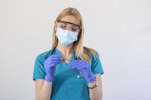 Medical healthcare holding COVID-19 , Coronavirus swab collection kit, wearing protective gloves, test tube for taking OP NP patient specimen sample,PCR DNA testing protocol process photo