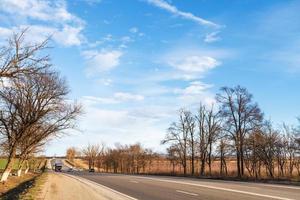 main road in country district in early spring photo