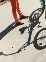 girl, bicycle and shadow photo
