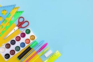 school stationery on yellow-blue background with copy space, back to school photo