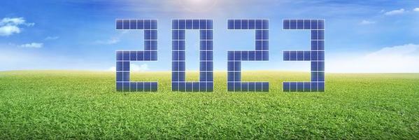 Number 2023 solar energy on lawn sustainable resources environmental topics Green energy concept, 3D isometric. 3D illustration. photo