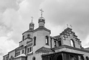 Christian church cross in high steeple tower for prayer photo