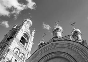 Christian church cross in high steeple tower for prayer photo