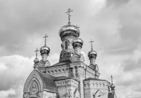 Christian church cross in high steeple tower for prayer photo