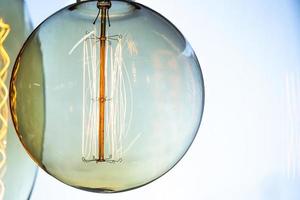 Vintage glass lights and lightbulbs for sale in a store photo