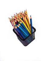 multi-colored felt-tip pens in a glass on a white background, close-up, copy space, contemporary art. Modern design photo