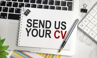 send us your cv words on notebook with laptop and charts photo