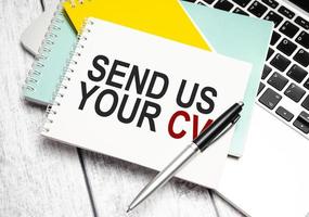 send us your cv . Conceptual background with chart ,papers and pen photo