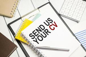 send us your cv . Conceptual background with chart ,papers and pen photo