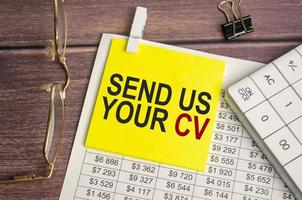 send us your cv Text on business paper on office table photo