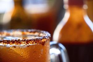 Mexican Michelada with dark beer photo