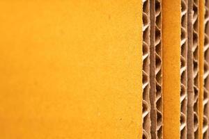 corrugated cardboard for packing. abstract background horizontal lines with wavy lines. Stack of unpacked not assembled cardboard box. photo