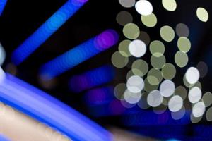 abstract blurred background of lights. Abstract blurry dark indoor plaza hall with a lot of small bokeh photo