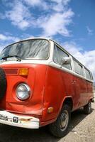 Red VW bus type 2 vintage campervan. The concept for the Type 2 is credited to Dutch Volkswagen importer Ben Pon.