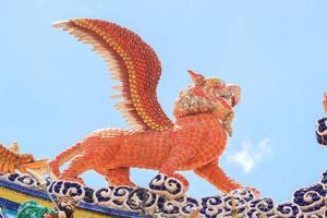 Flying tiger statues, a mythical animal in Chinese literature, are often decorated in temples and on the roof as beautiful sculptures. photo