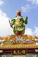 The entrance arches of Chinese temples feature statues of dragons and flying tigers, mythical creatures in Chinese literature, often adorned in temples, and on the roofs are beautiful sculptures photo