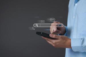 Search engine optimization, SEO, Searching Browsing Internet Data Information Networking Concept, Businessman use smartphone for find data on networking, copy space. photo