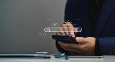 Search engine optimization, SEO, Searching Browsing Internet Data Information Networking Concept, Businessman use smartphone for find data on networking, copy space. photo