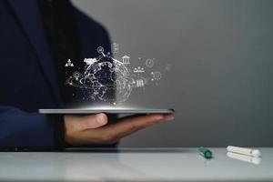 Digital business internet connection online network. Businessman use tablet access digital online global business, technology, long term investment plan, financial stability, global marketing analysis photo
