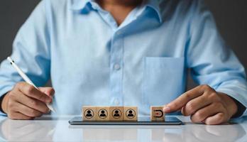 Inbound marketing strategy, customer retention, digital marketing and attracting potential customers in business concept. Wooden cubes with magnet icon attracts the customer icons. Business strategy. photo