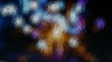 Purple Neon Blurred Lights Through Glass Window With Raindrops On It photo