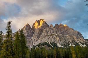 Sunrise in dolomites alp mountains, Belluno Province, Dolomiti Alps, Italy photo