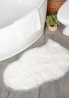 fluffy white rug in ordinary bathroom, mockup design photo