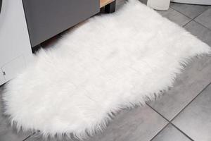 fluffy white rug in ordinary bathroom, mockup design photo