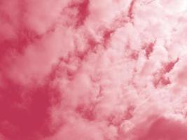 Beautiful fluffy white cloud against the Magenta sky. Sky clouds. Abstract background texture. Copy space. The concept of hope. Color 2023 Viva Magenta photo