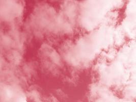 Beautiful fluffy white cloud against the Magenta sky. Sky clouds. Abstract background texture. Copy space. The concept of hope. Color 2023 Viva Magenta photo