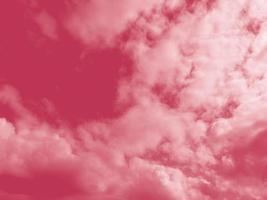 Beautiful fluffy white cloud against the Magenta sky. Sky clouds. Abstract background texture. Copy space. The concept of hope. Color 2023 Viva Magenta photo