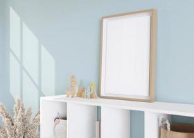 Empty vertical picture frame standing on sideboard in modern child room. Frame mock up in contemporary style. Free, copy space for picture, poster. Toys, pampas grass. Close up view. 3D rendering. photo