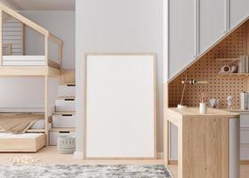 Empty vertical picture frame standing on the floor in modern child room. Mock up interior in contemporary, scandinavian style. Copy space for picture. Bed, toys, desk. Cozy room for kids. 3D render. photo
