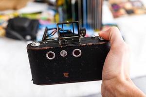 vintage photo camera and album with old photos, memories
