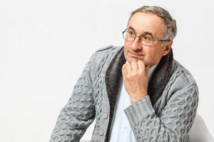 Smiling happy elderly man. Isolated over white background photo