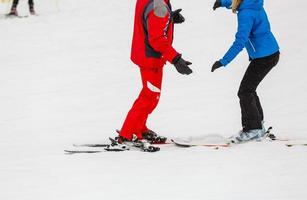 Skiing, little skier in ski school photo