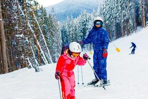 Image of sporty family spending time on winter resort during vacations photo