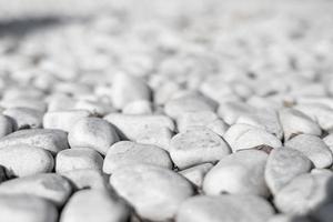 White stone background, stones - abstract background with round pebbles photo