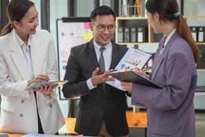 Marketing, Finance, Accounting, Planning, The company is team of marketers analyzes the company is profits using laptop computer graphs and calculators and tablet.Business concept photo