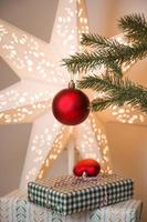 Vertical christmas banner with xmas tree bramches decorated with ornaments with sparkling bokeh photo