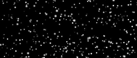 Falling snow isolated on black background. Falling snow at night. Bokeh lights on black background, flying snowflakes in the air. Winter weather. Overlay texture. photo