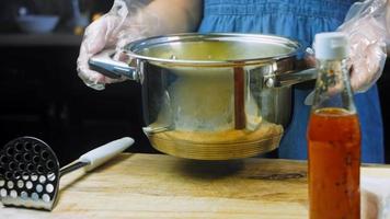 The chef grinds the mashed potatoes. Mix the puree with the egg yolks. Macro shooting video