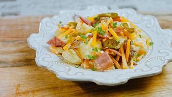 Jalapeno pepper, potato salad with bacon. Food in the retro style of the 20s video