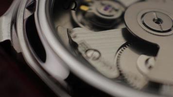 Macro close up of an automatic mechanical field watch with moving arms video