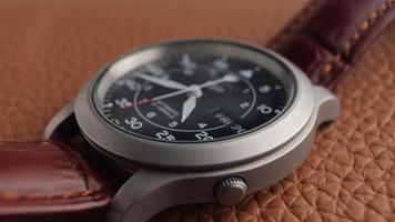 Macro close up of an automatic mechanical field watch with moving arms video