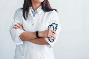 Close up view of young nurse that indoors in modern clinic. Conception of healthcare photo