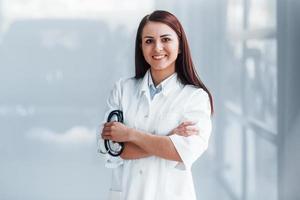 Young nurse indoors in modern clinic. Conception of healthcare photo